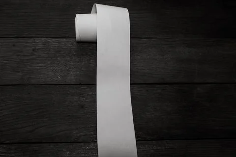Roll of cash register tape, empty blank tax receipt on table isolated. Plan.. Stock Photos