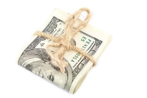 Roll of dollar banknotes isolated on white background. Stock Photos