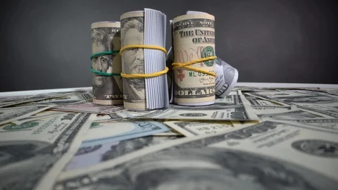 Roll of dollar bills on gray 動画素材 127392536