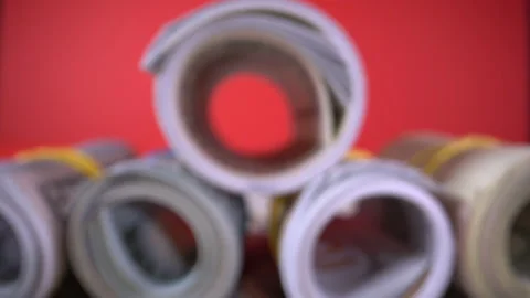 Roll of dollar bills on red Видео 133910724