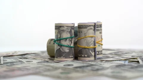 Roll of dollar bills on white Stockbeeldmateriaal 127379657