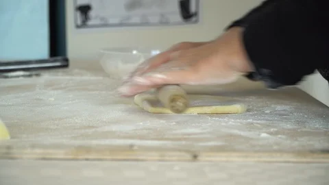 Roll the dough side view angle Stockbeeldmateriaal 128987879