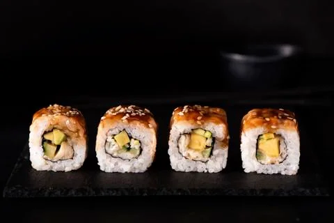Roll with eel, crab and mango Stock Photos