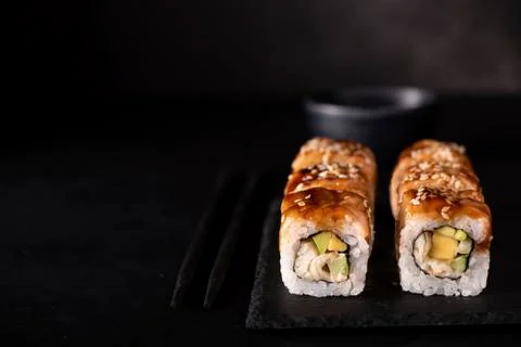 Roll with eel, crab and mango Stock Photos