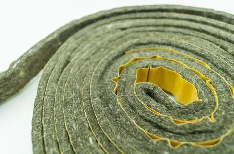 A roll of felt insulation. Self-adhesive tape with felt insulation for entrance Stock Photos
