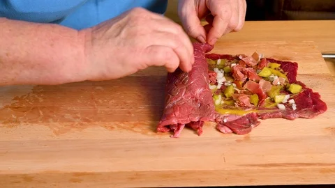 Roll up the finished roulade of beef. Stock Footage 123580745