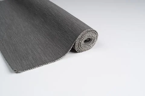 A roll of gray fabric Stock Photos