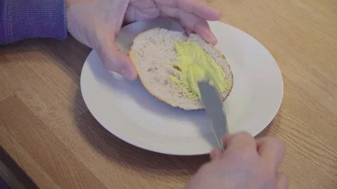 Roll half lubricate with curry spread Stock Footage 119603481
