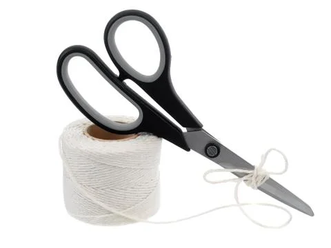 Roll of hemp string and scissors isolated on white Stock Photos