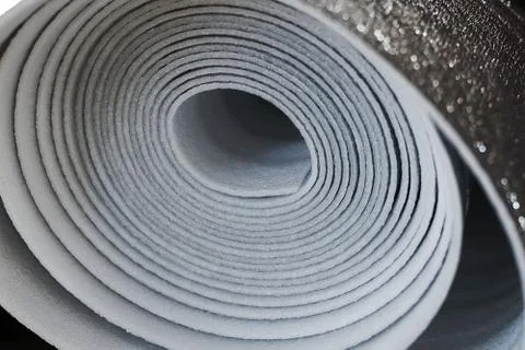 A roll of insulation material from foamed polyurethane close up Foto stock