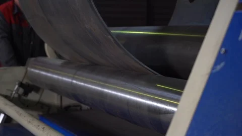 Roll machine bend sheet of metal into pipe, automation of production, equipment Stock Footage 120062412