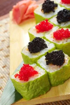 Roll made of smoked fish and  roe Photos