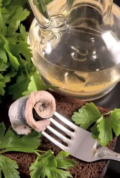 Roll of the marinated sprat with bread Stock Photos