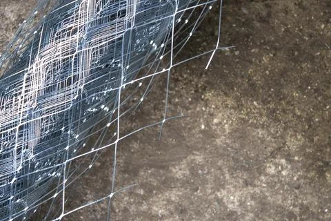 Roll of a metal grid closeup Stock Photos