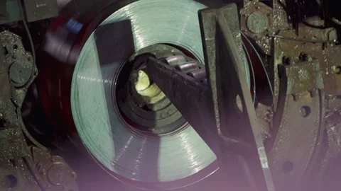 Roll of metal sheets on industrial machine. Automation of work. Stock Footage 187573404
