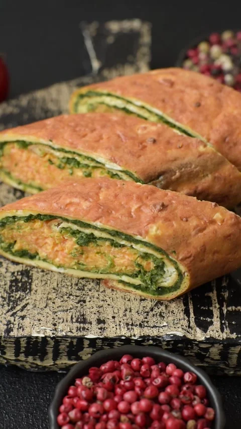 Roll of omelette, spinach, cheese and minced meat Stock Footage 310903563