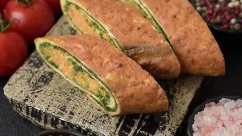 Roll of omelette, spinach, cheese and minced meat Stock Footage 310903564