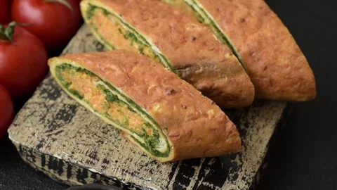 Roll of omelette, spinach, cheese and minced meat Stock Footage 310903567