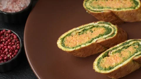 Roll of omelette, spinach, cheese and minced meat Stock Footage 310903575
