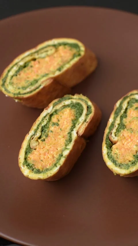 Roll of omelette, spinach, cheese and minced meat Stock Footage 310903582