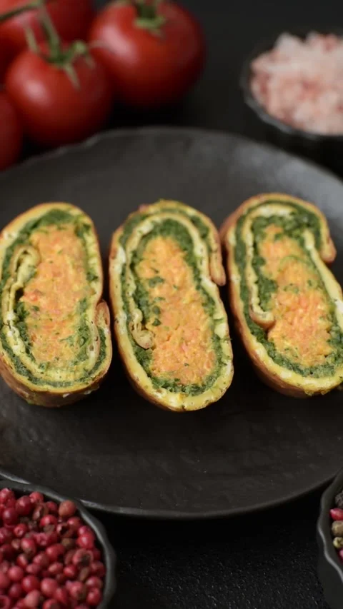 Roll of omelette, spinach, cheese and minced meat Stock Footage 310903584