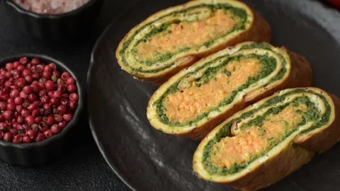 Roll of omelette, spinach, cheese and minced meat Stock Footage 310903590