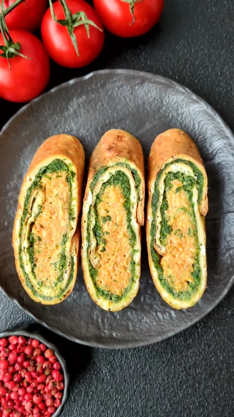 Roll of omelette, spinach, cheese and minced meat Stock Footage 310903677