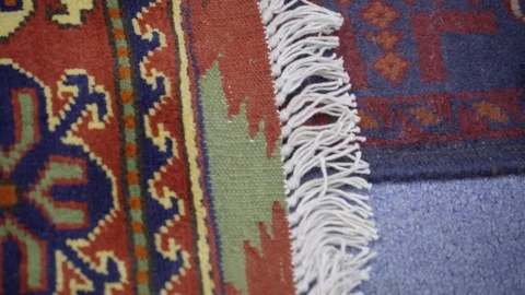 Roll open muslim prayer mat with leg step on it Stock Footage 104860670