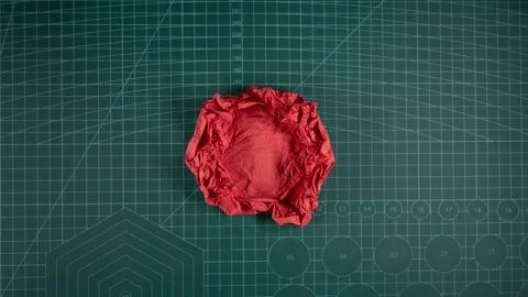 Roll out the ball of crumpled paper Stock Footage 241544725