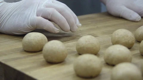 Roll out the dough balls Stock Footage 70004105