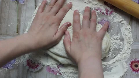 Roll out the dough for the Easter cake.roll out the pizza dough.international Stock Footage 133501342