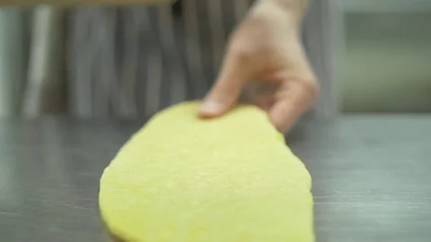 Roll out dough for pasta use rolling pin slow motion close-up. Chef hands roll Stock Footage 74716636