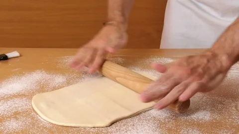 Roll out the dough to a rectangle. Making Puff Pastry Series. Stock Footage 77223254