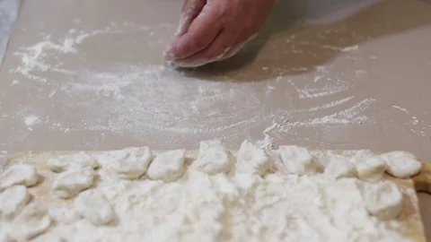 Roll out the dough with a rolling pin Stock Footage 126362127