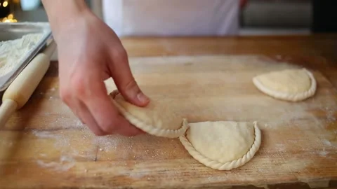 Roll out the dough with a rolling pin. Put the filling on the dough Stock-Footage 148191141