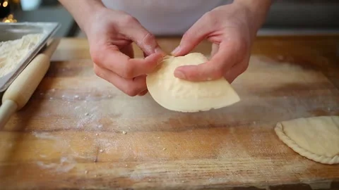 Roll out the dough with a rolling pin. Put the filling on the dough Stock-Footage 148191171