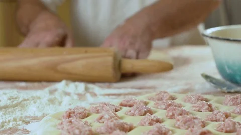 Roll out a dough sheet on the table hd Video stock 80044411
