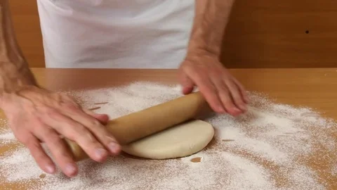 Roll out dough to square. Making Puff Pastry Series. Stock Footage 77222797