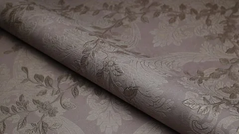 Roll of paper wallpaper on the wall with texture, camera movement slowly 库存影片 306543454
