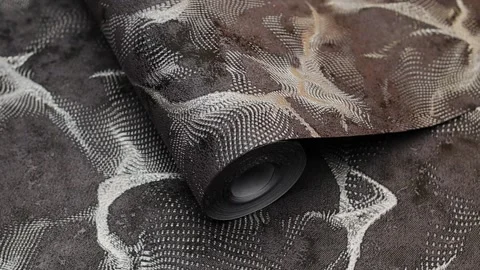 Roll of paper wallpaper on the wall with texture, camera movement slowly Stock Footage 306543519