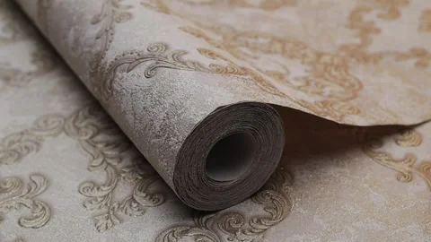 Roll of paper wallpaper on the wall with texture, camera movement slowly Stock Footage 306543665