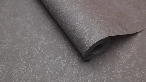 Roll of paper wallpaper on the wall with texture, camera movement slowly Stock Footage 306543929