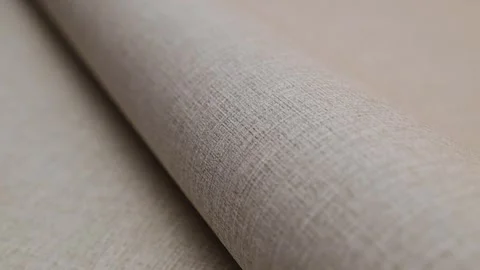 Roll of paper wallpaper on the wall with texture, camera movement slowly Stock Footage 306544396