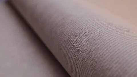 Roll of paper wallpaper on the wall with texture, camera movement slowly 库存影片 306544838