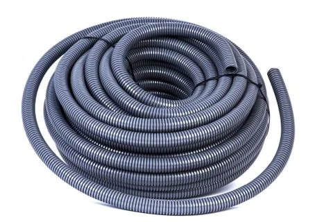 Roll of plastic corrugated pipe for electrical installation isolated on white Stock Photos