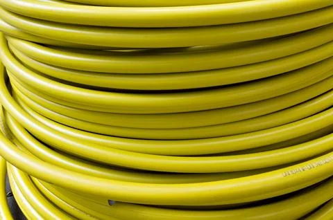 Roll of plastic yellow cable, texture Foto stock