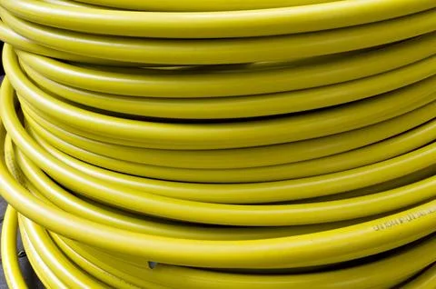 Roll of plastic yellow cable, texture Foto stock