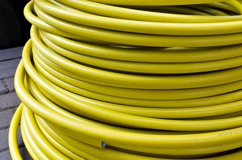 Roll of plastic yellow cable, texture Foto stock