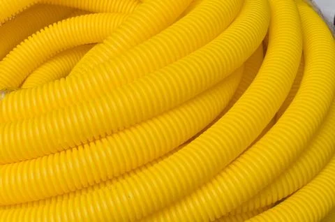 Roll of plastic yellow pipe, texture Foto stock