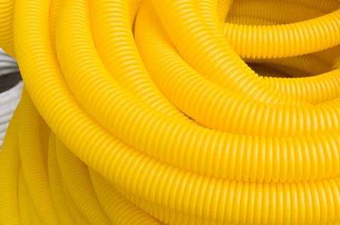 Roll of plastic yellow pipe, texture Stock-Fotos